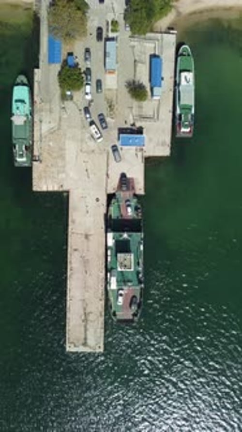 Ferry Carrying Cars and Passengers Across the Sea Top Down Aerial Drone View Aerial Vertical View on
