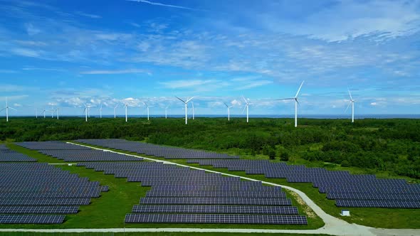 Aerial of Solar panel sun array electricity and wind farm park, green ...