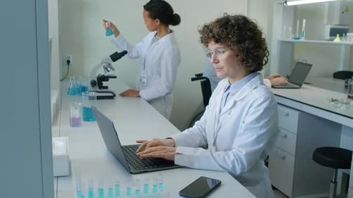 Scientists Working Diligently in Modern Research Laboratory