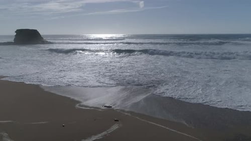 Aerial view beautiful beach with views of ocean waves and water crashing on to sandy beach