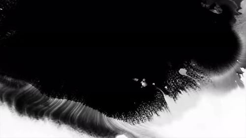 Black Ink Spreading on White Surface Background