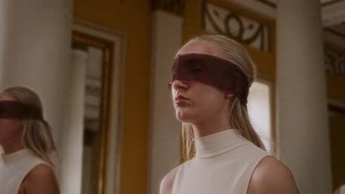Blonde Girl In Sheer Blindfold Holding Still Pose