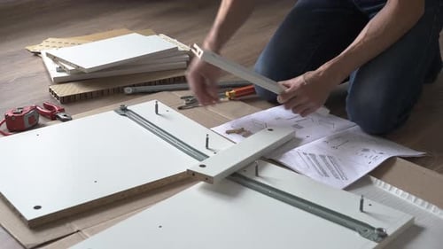 Person Assembling Furniture at Home