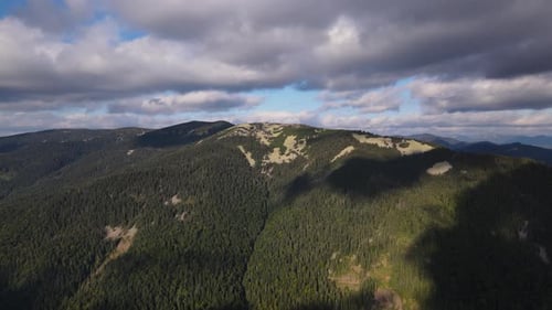 Scenic Aerial View of the Carpathian Mountain Range Drone Flies Forwards Over Mount Illuminated By