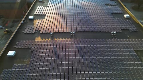 Aerial view of rooftop solar panels showcasing renewable energy infrastructure