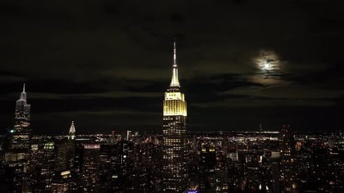 Aerial view of illuminated skyline at night, United States.