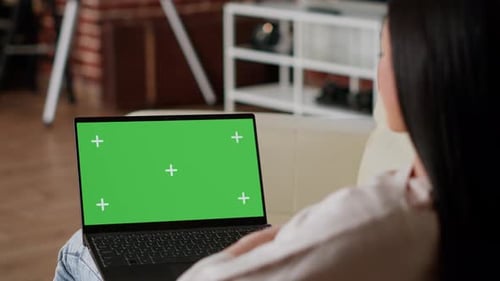 Woman Having Laptop with Green Screen Chroma Key Template Display