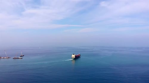 Aerial footage over Container Cargo Ship Sailinig in Mediterranean Sea