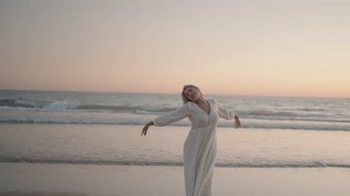 Woman Dancing On The Beach
