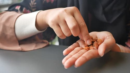 Hand Selecting Fresh Almonds