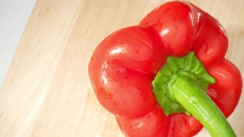 Red Pepper on a Wooden Cutting Board