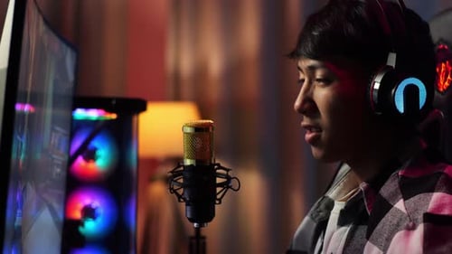 Asian Boy Streamer Celebrating Winning Game On Computer. Live Stream Video Game