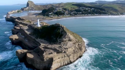 Lighthouse Landmark at Castlepoint on North Island of New Zealand - Aerial Circling View