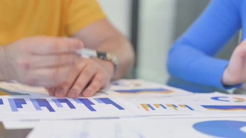 Close up of Creative People Working on Business Report