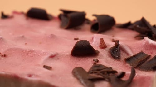 Delicious Frosted Cake with Chocolate Curls