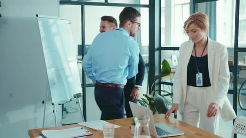 A Video Shows a Man Presenting in an Office Highlighting Teamwork