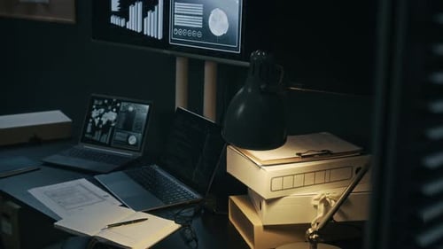 Workspace with Laptops and Analytical Screens in Command Center