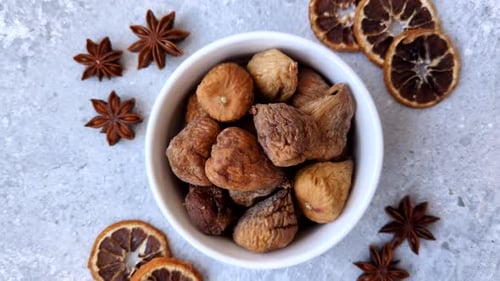 Dried fig are a sweet, healthy fruit for vegans and vegetarians. Dried fig as a food background