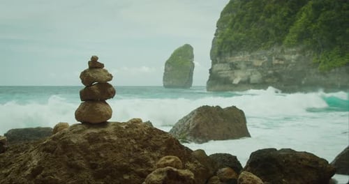 Tropical Beach Scene with Stacked Rocks