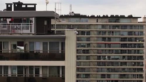 Clothes Fluttering on a Brussels Balcony Illustrate Daily Urban Life The Wind Playfully Lifts the