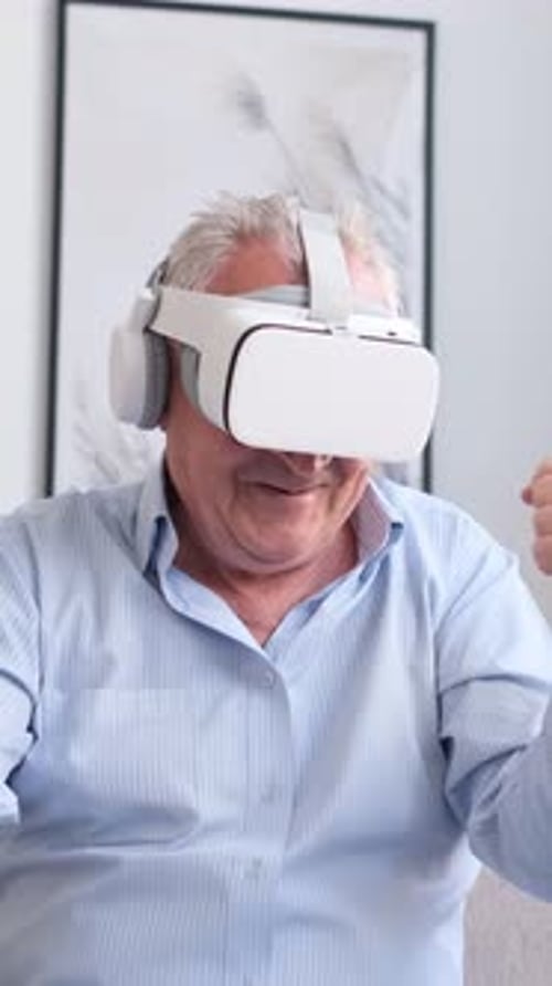 Senior Man Experiencing Virtual Reality at Home