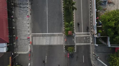 aerial footage, zebra crossing as a facility for pedestrians to cross the highway. Quite a busy road