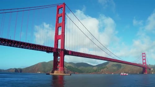 Aerial View Over Water Looking Up at Golden Gate Bridge and Blue