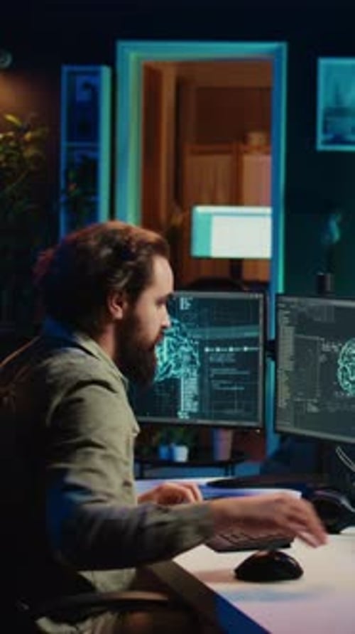 Vertical Video Developer Inserting Disk Into PC Containing Conscient AI Waving Hand