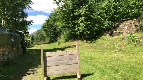 Tervuren dog jumps over obstacle in Slow Motion. In back garden.