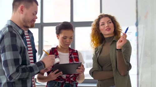 Creative Team Brainstorming Together in Modern Bright Office
