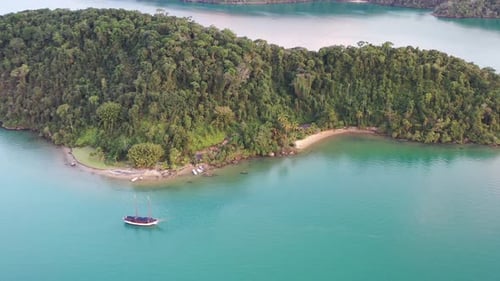Tropical island and charter boat