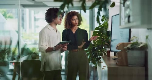 Tablet, office and business people in discussion with graph, statistics