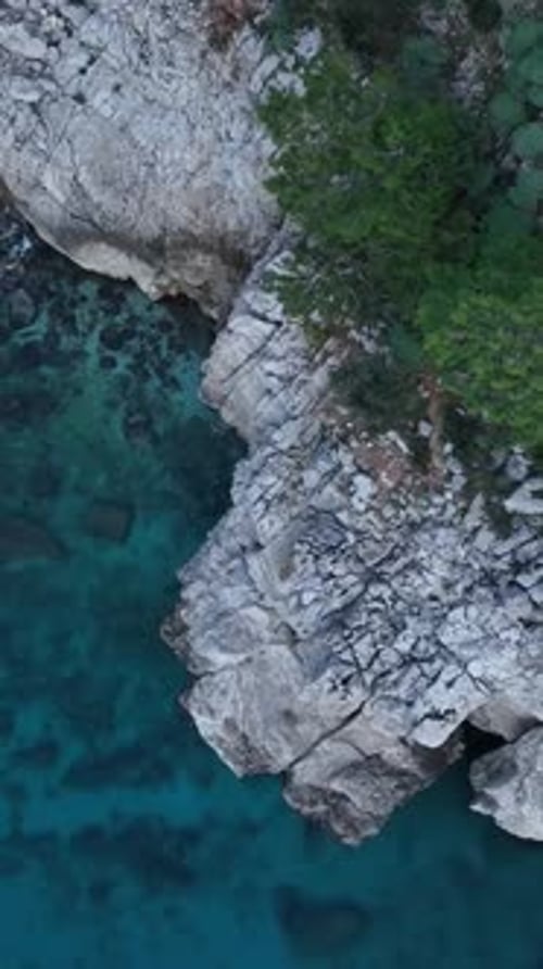 Aerial view of rocky coastline with turquoise water