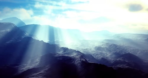 Heavenly Sun Rays Over Misty Mountain Landscape