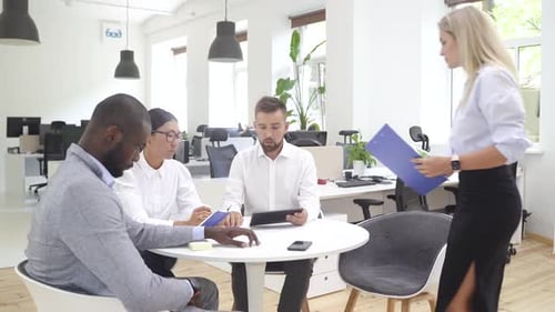 Multiethnic Business People During Meeting in Modern Office