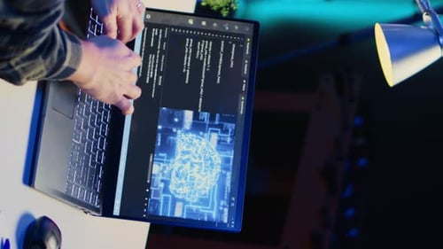Vertical Video Teleworking IT Specialist in Apartment Office Uses Programming to Upgrade AI