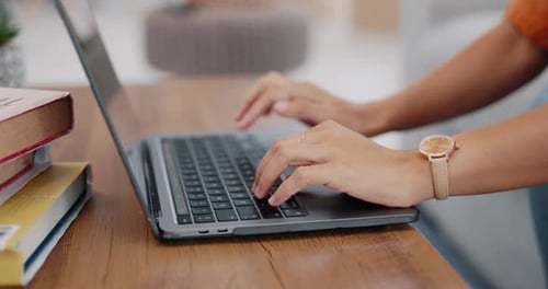 Hands of person, laptop and studying in home with elearning, social media and blog post on website