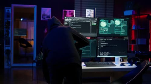 Hacker Arriving in Underground HQ Ready to Start Coding Malware