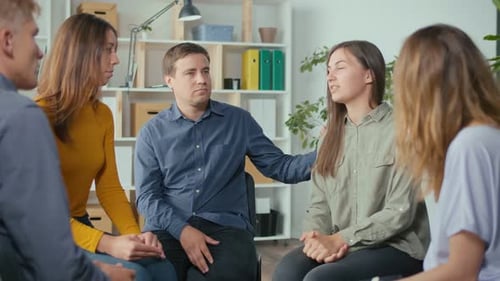 Adults Attending Support Group Meeting in Bright Room
