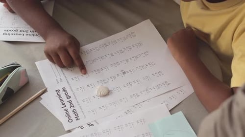 Kids Doing Math Worksheets at Home