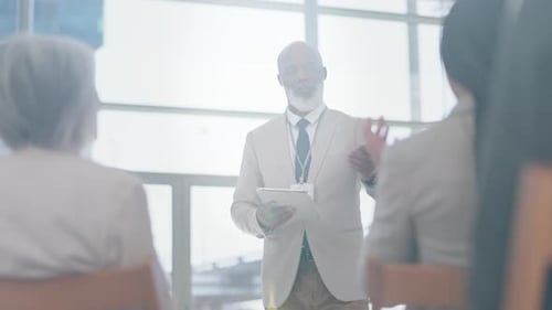 Presentation, meeting and black man on tablet with question in audience for conference or tradeshow