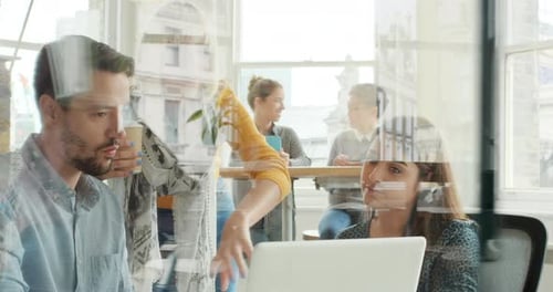 Diverse Team Collaborating in Modern Office Environment