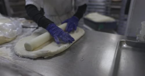 Female Baker Preparing Bread Dough in Bakery Kitchen 10 Seconds or Greater