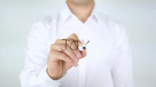 Person Writes the Word JOY on Glass