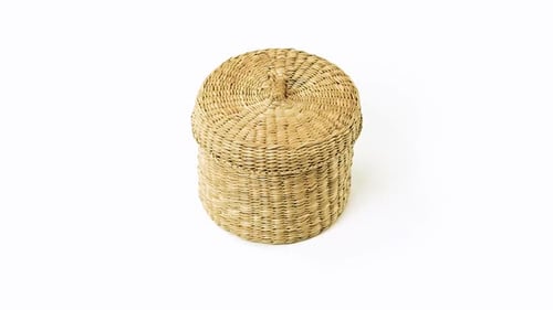 Close Up of Round Wicker Basket with Lid