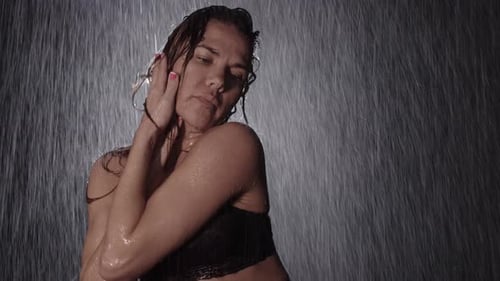 Woman Dancing in Water with Dark Lingerie