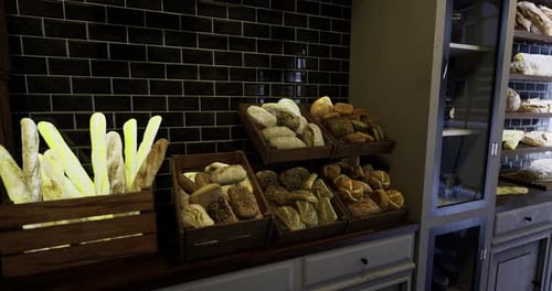 Delicious Assortment of Freshly Baked Bread Displayed in a Cozy Bakery