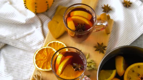 Christmas and Seasonal Drinks Concept - Glasses of Hot Mulled Wine With