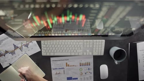 A Man Works at a Computer in the Office