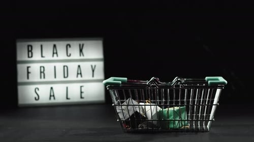 Shopping Basket Filling with Presents for Black Friday